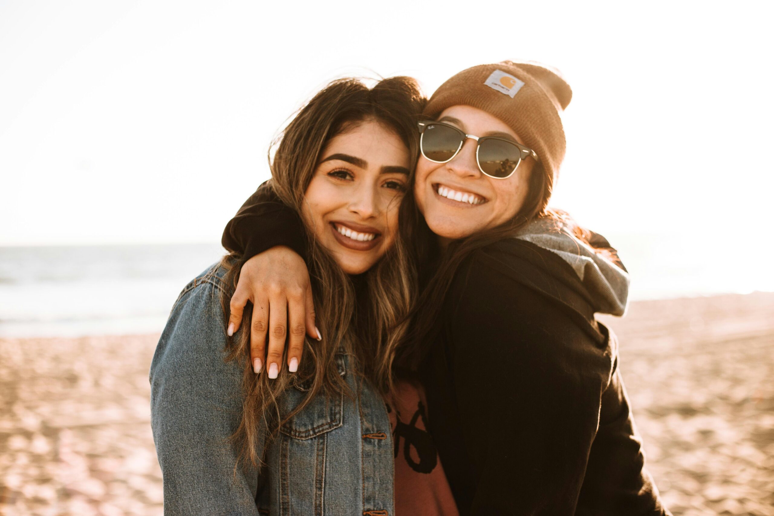 Two women hugging each other